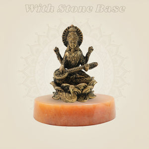 Bronze Chaturbhuja Saraswati Idol on Lotus on yellow stone