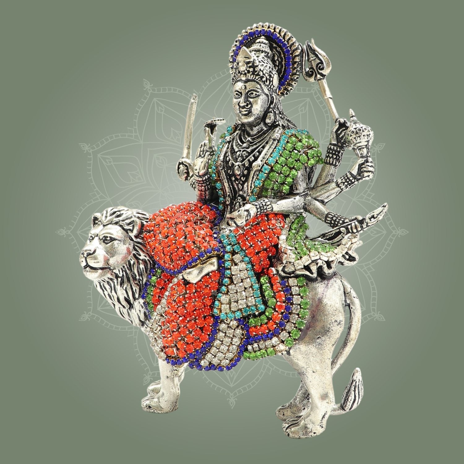 Decorative brooch with a figure on a lion, featuring colorful gemstones on a gray background
