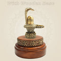 Traditional Brass Shiva Lingam with Naag Canopy on Wooden Base 4.25" - Luxeartisanship